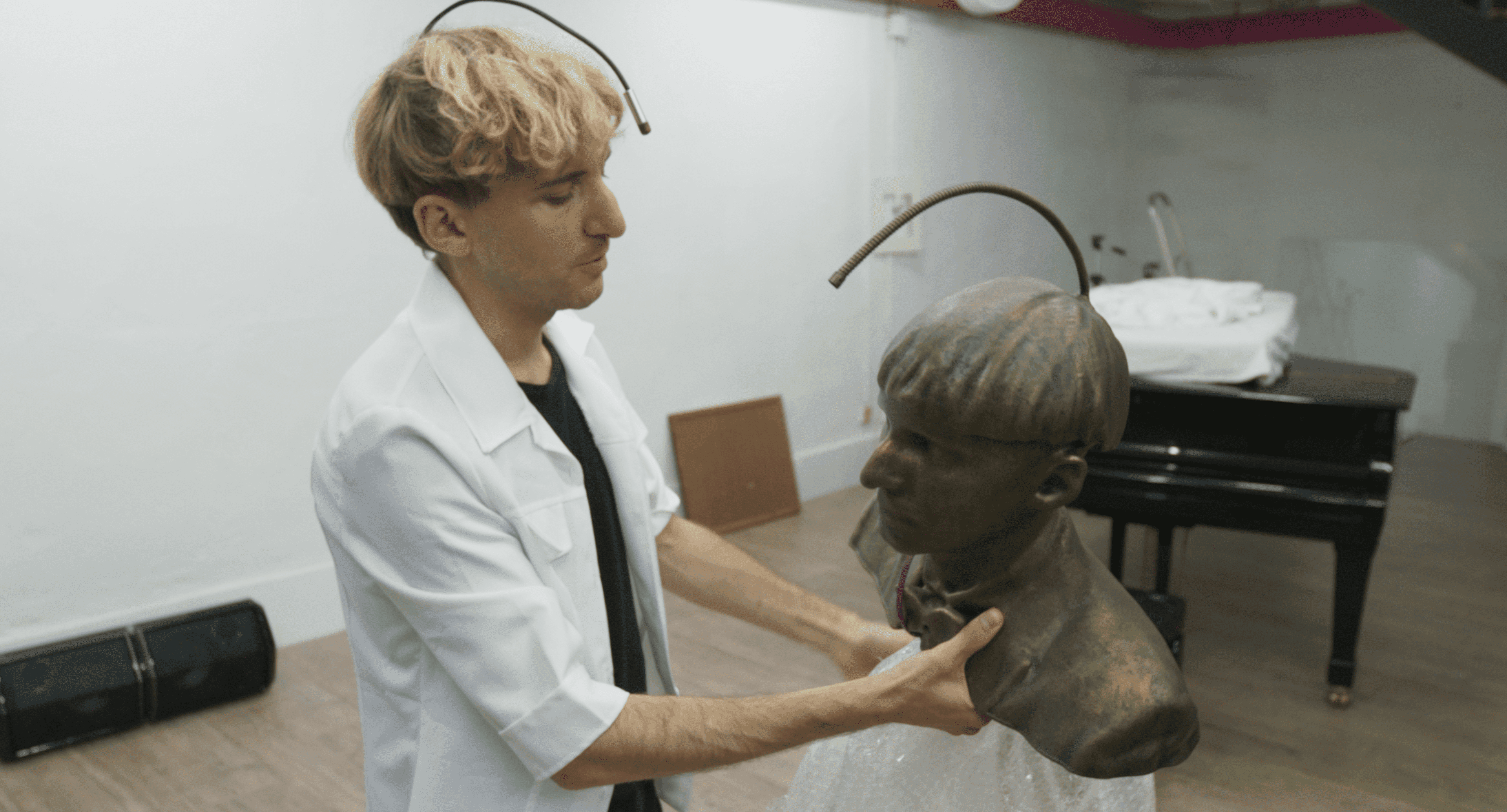 Neil inspecting his statue